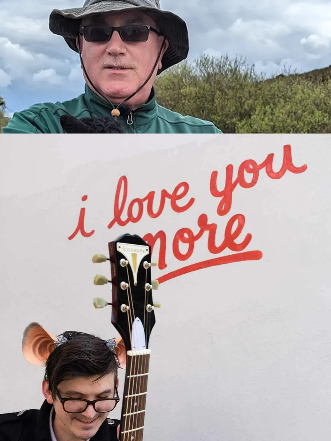 A split frame; on the top is David Donohue, a white man with spectacles in a wide-brimmed hat. On the bottom is Lore the Mouse, a young bespectacled person with short black hair and black spectacles and large mouse ears. They hold a guitar and sit in front of a white wall, which contains a cursive graffito that reads, 'I love you more.'